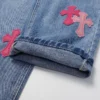 Chrome Hearts rosa Jeans med korslogotyp