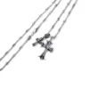 Litet kors- och babyfat-charmhalsband med diamanter